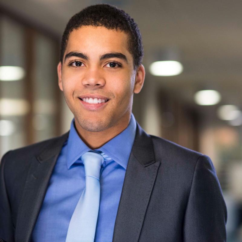 Headshot of smiling well-dressed employee